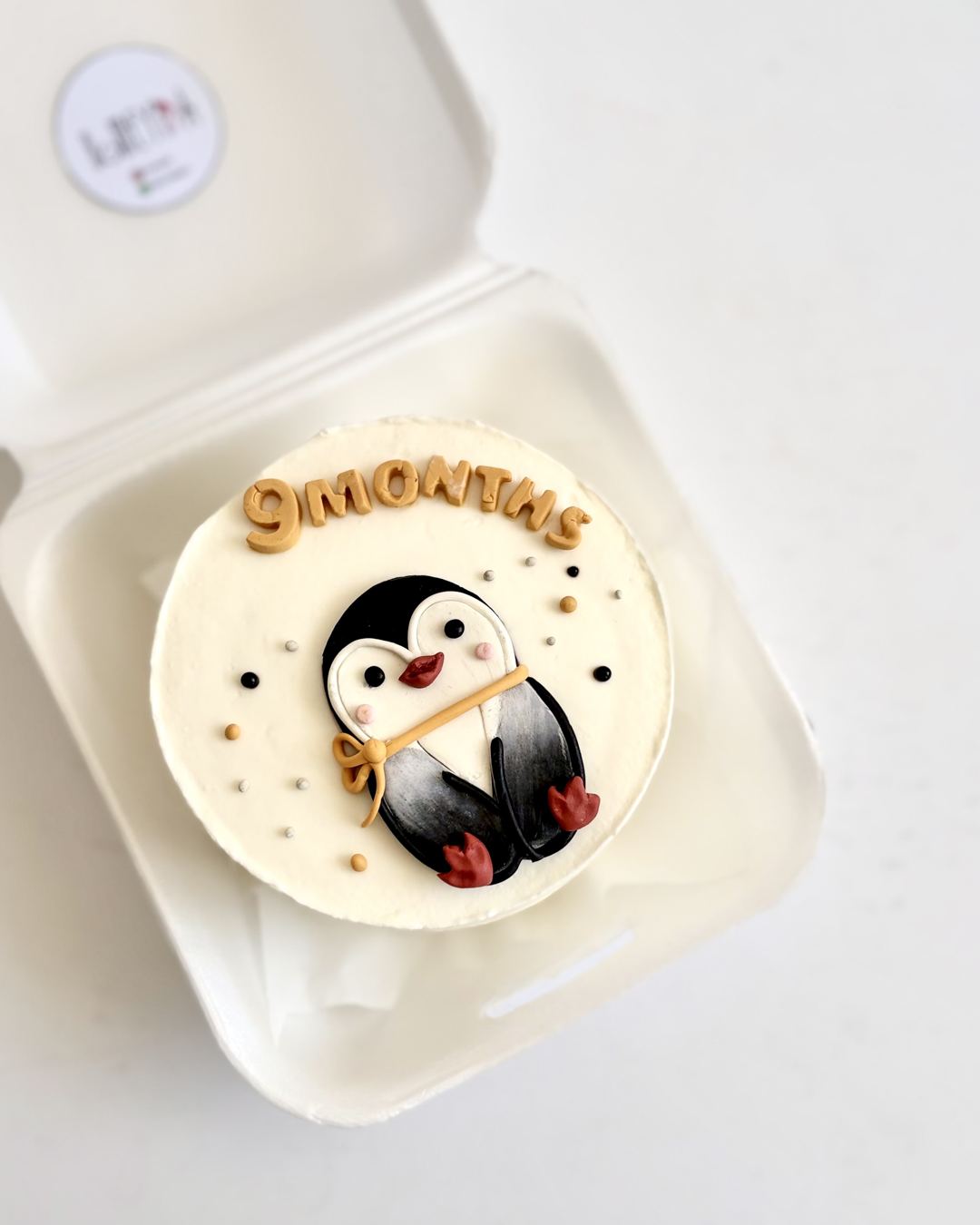 Penguin bento milestone cake